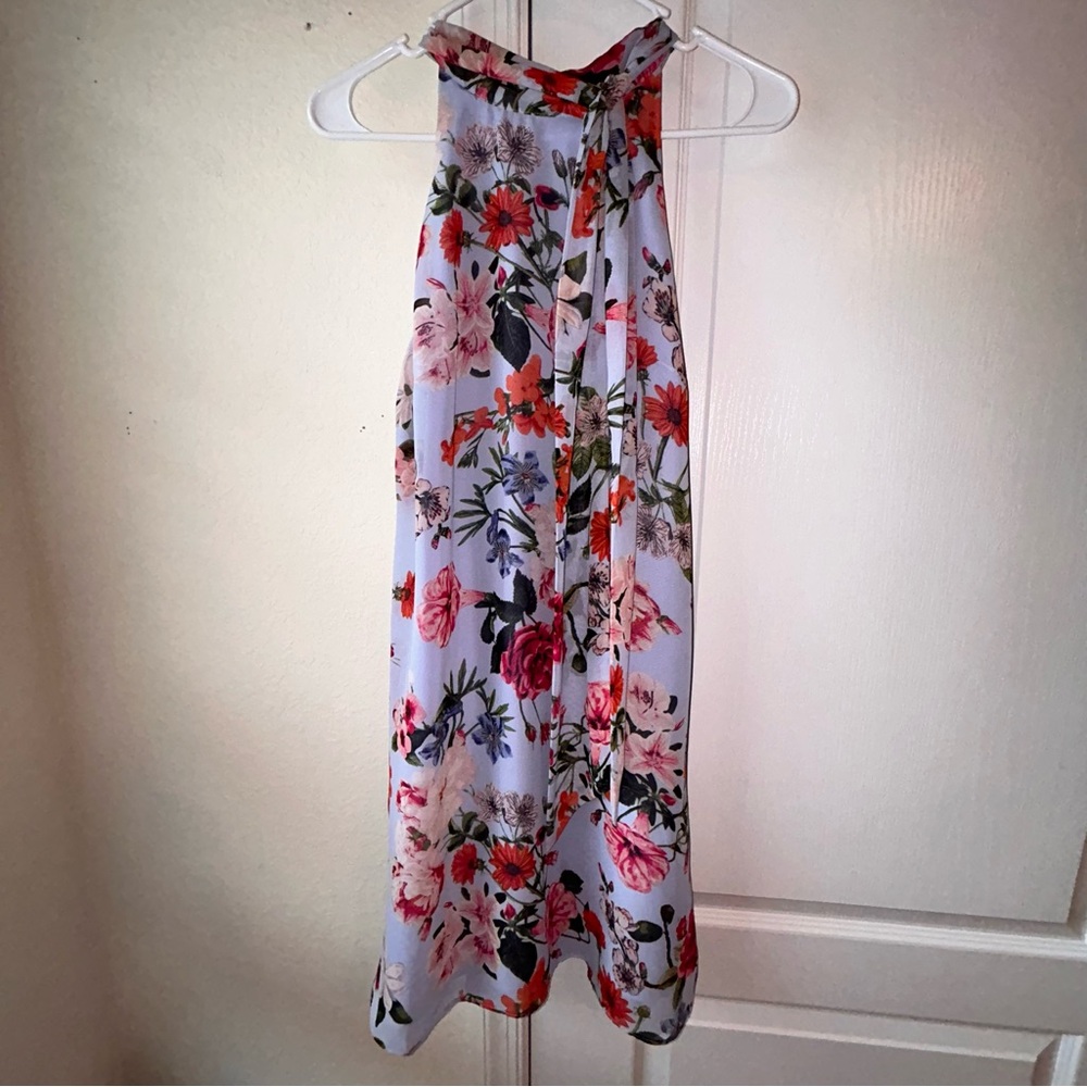 Size 8 Vince Camuto dress . Blue with floral patterns, worn once .